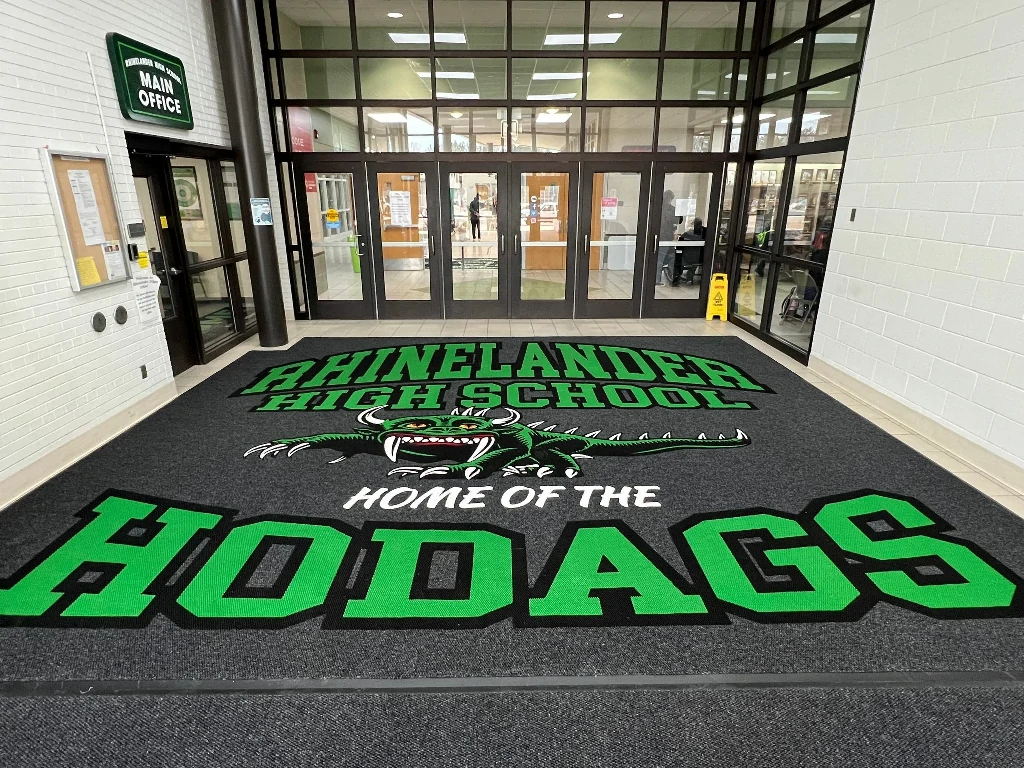 Branded entrance mat in retail store